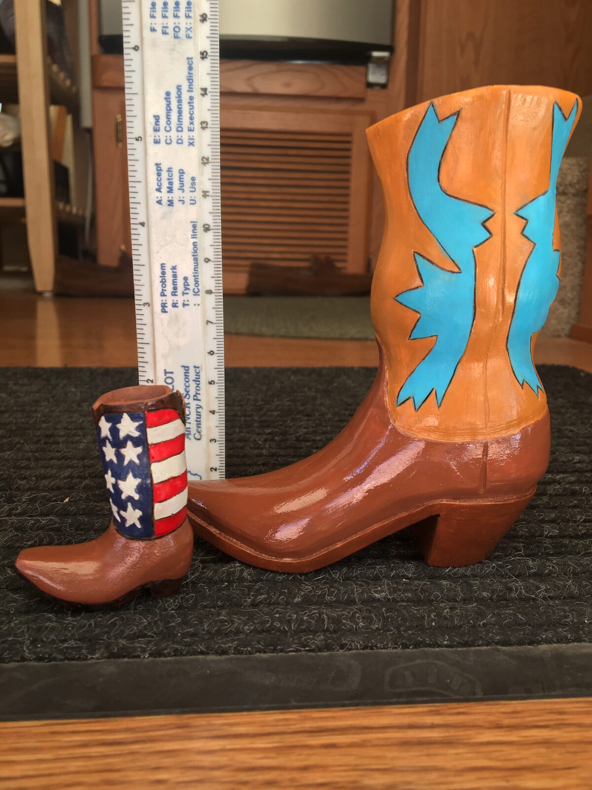Hand-carved wooden boots by John Beckman