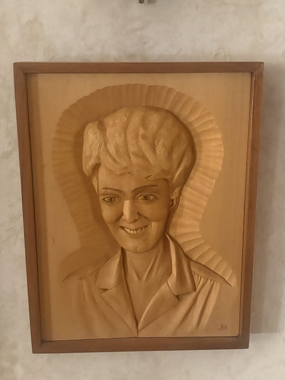 Hand-carved wooden portrait of Gerri by John Beckman