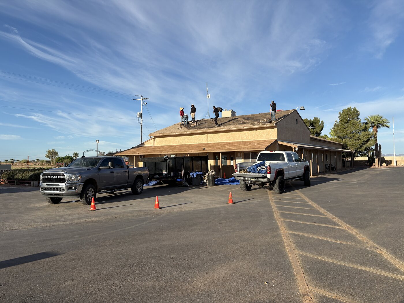 A roofing crew replacing the clubhouse roof.